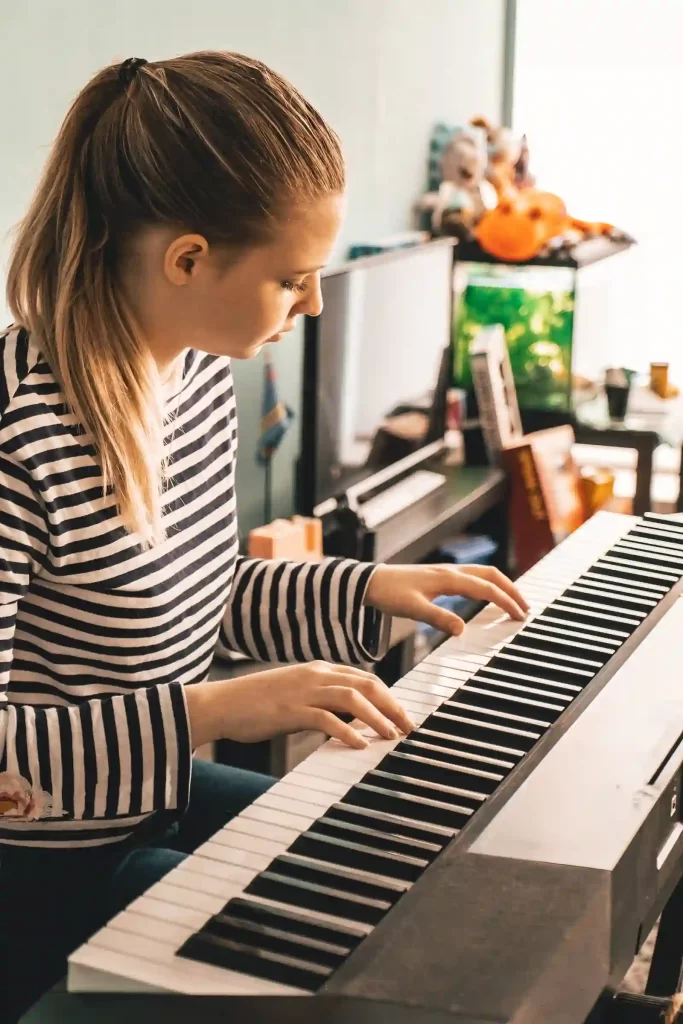 Young person playing piano